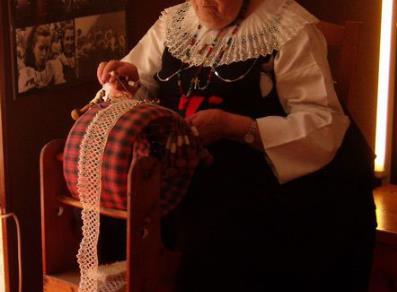 Craftswoman in typical Cogne dress