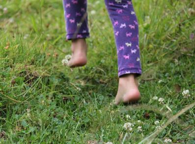 Kid running on a meadow